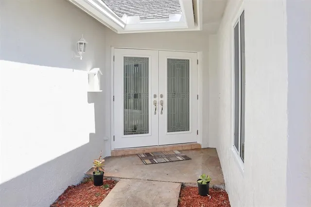 a view of a door and chair in a room