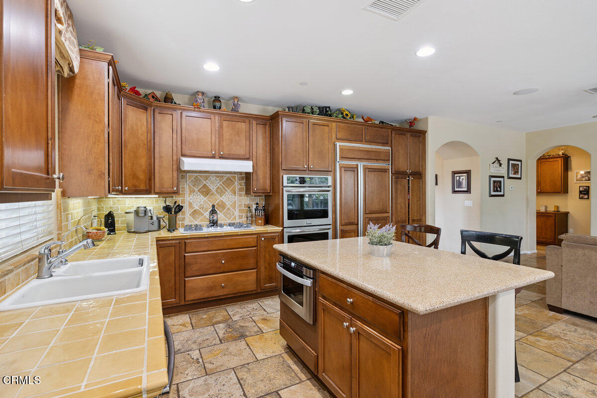 3401 Aviara Lane Oxnard, CA 93036 - Photo 2 of 55 a kitchen with kitchen island granite countertop a sink and counter space