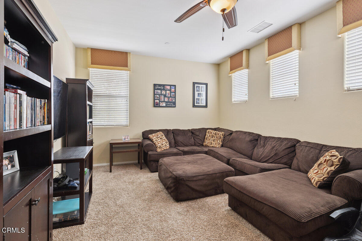 3401 Aviara Lane Oxnard, CA 93036 - Photo 22 of 55 a living room with furniture fireplace and a window