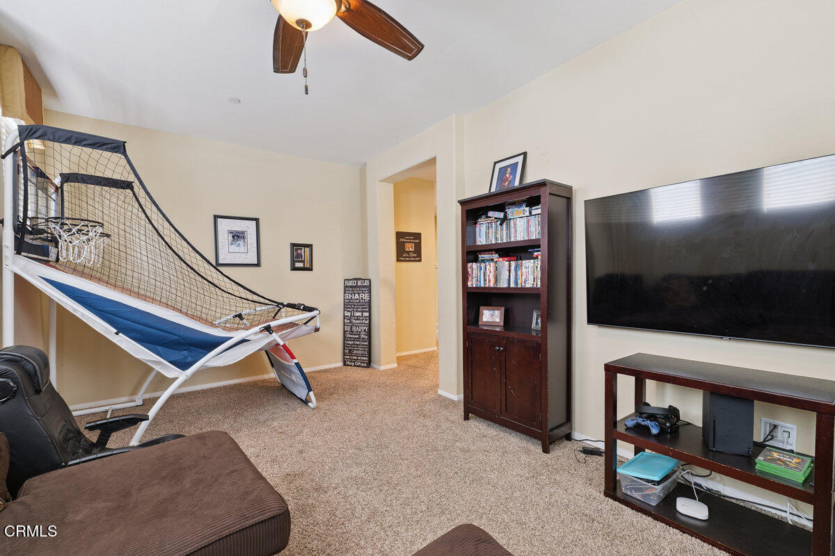3401 Aviara Lane Oxnard, CA 93036 - Photo 23 of 55 a living room with furniture and a flat screen tv