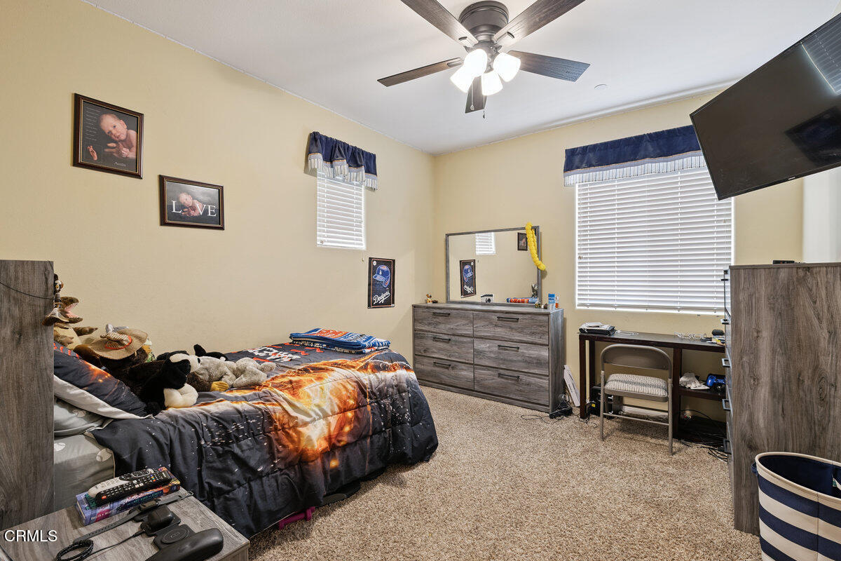 3401 Aviara Lane Oxnard, CA 93036 - Photo 24 of 55 a bedroom with a bed and a flat screen tv