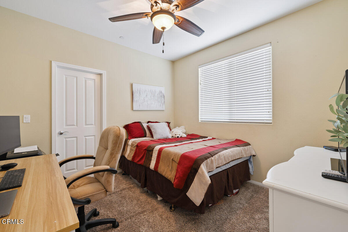 3401 Aviara Lane Oxnard, CA 93036 - Photo 28 of 55 a bed room with a bed and a table