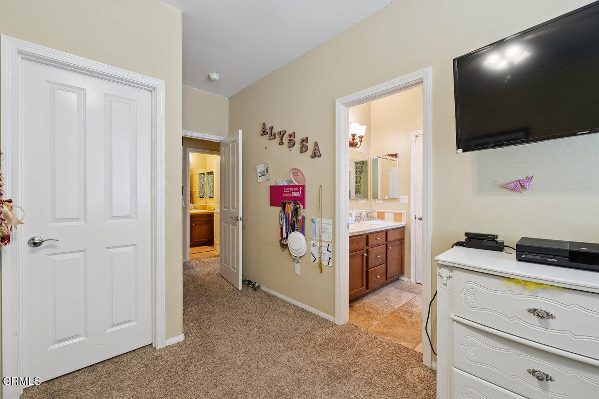 3401 Aviara Lane Oxnard, CA 93036 - Photo 29 of 55 a view of a livingroom with furniture and a flat screen tv