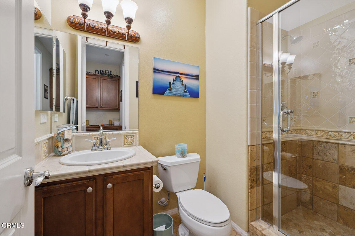 3401 Aviara Lane Oxnard, CA 93036 - Photo 36 of 55 a bathroom with a sink a toilet and shower