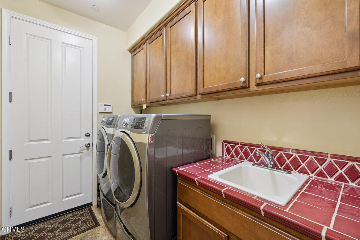 3401 Aviara Lane Oxnard, CA 93036 - Photo 37 of 55 a utility room with dryer and washer