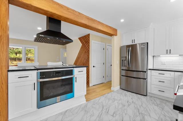 a kitchen with appliances and cabinets
