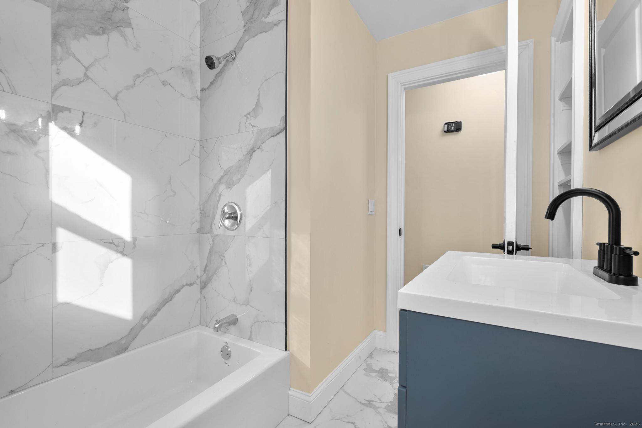 24 Evergreen Road North Branford, CT 06472 - Photo 15 of 31 a bathroom with a sink and a bathtub