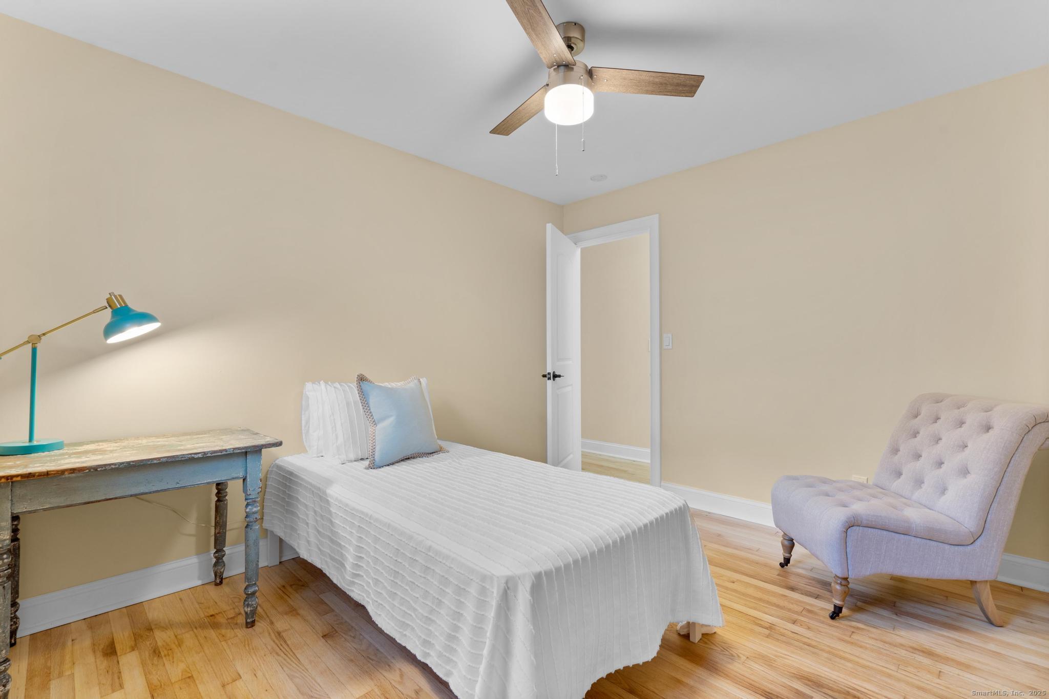 24 Evergreen Road North Branford, CT 06472 - Photo 20 of 31 a bedroom with a bed and a chair