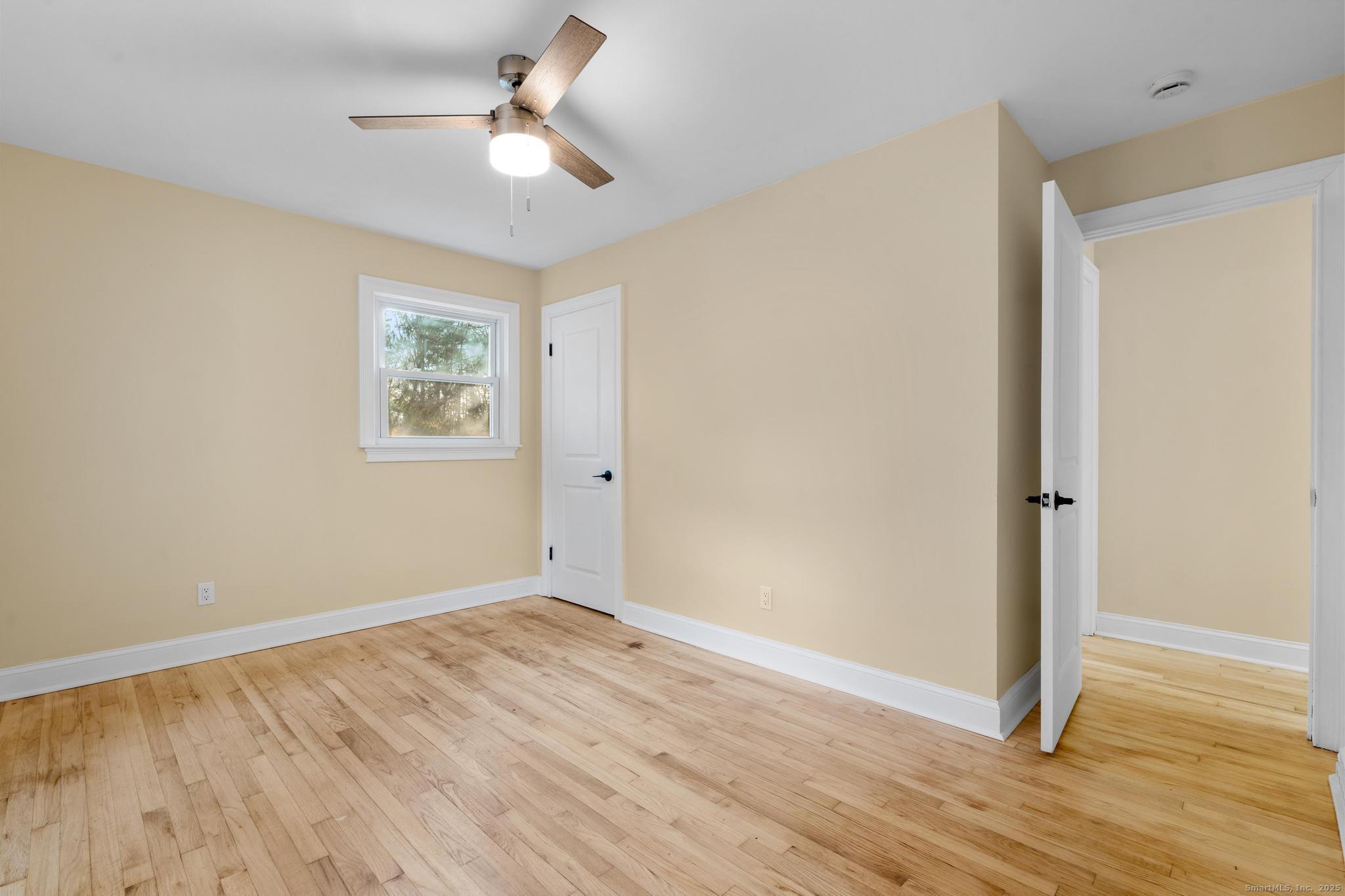 24 Evergreen Road North Branford, CT 06472 - Photo 21 of 31 a view of room with wooden floor and ceiling fan