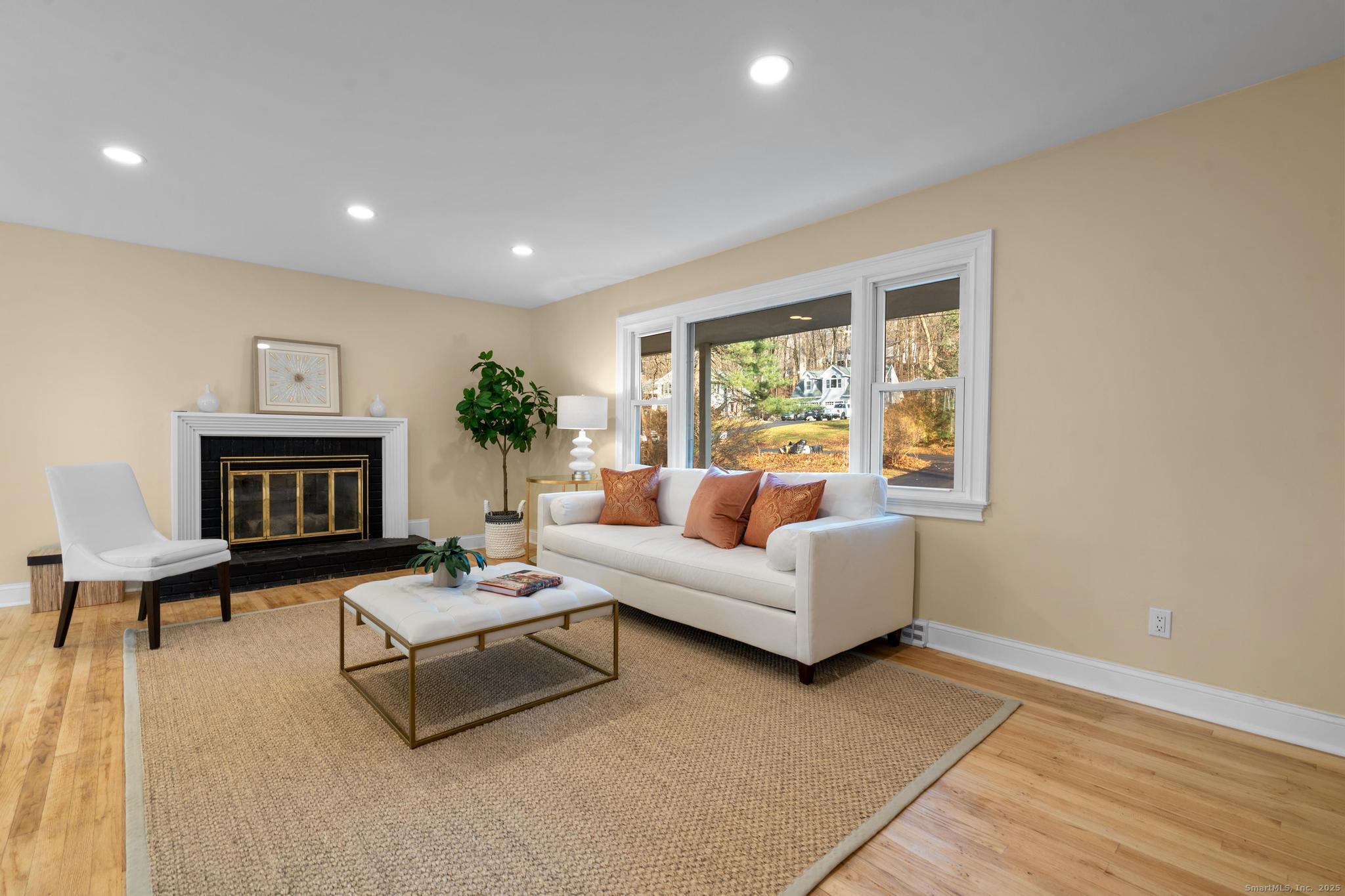 24 Evergreen Road North Branford, CT 06472 - Photo 7 of 31 a living room with furniture and a fireplace