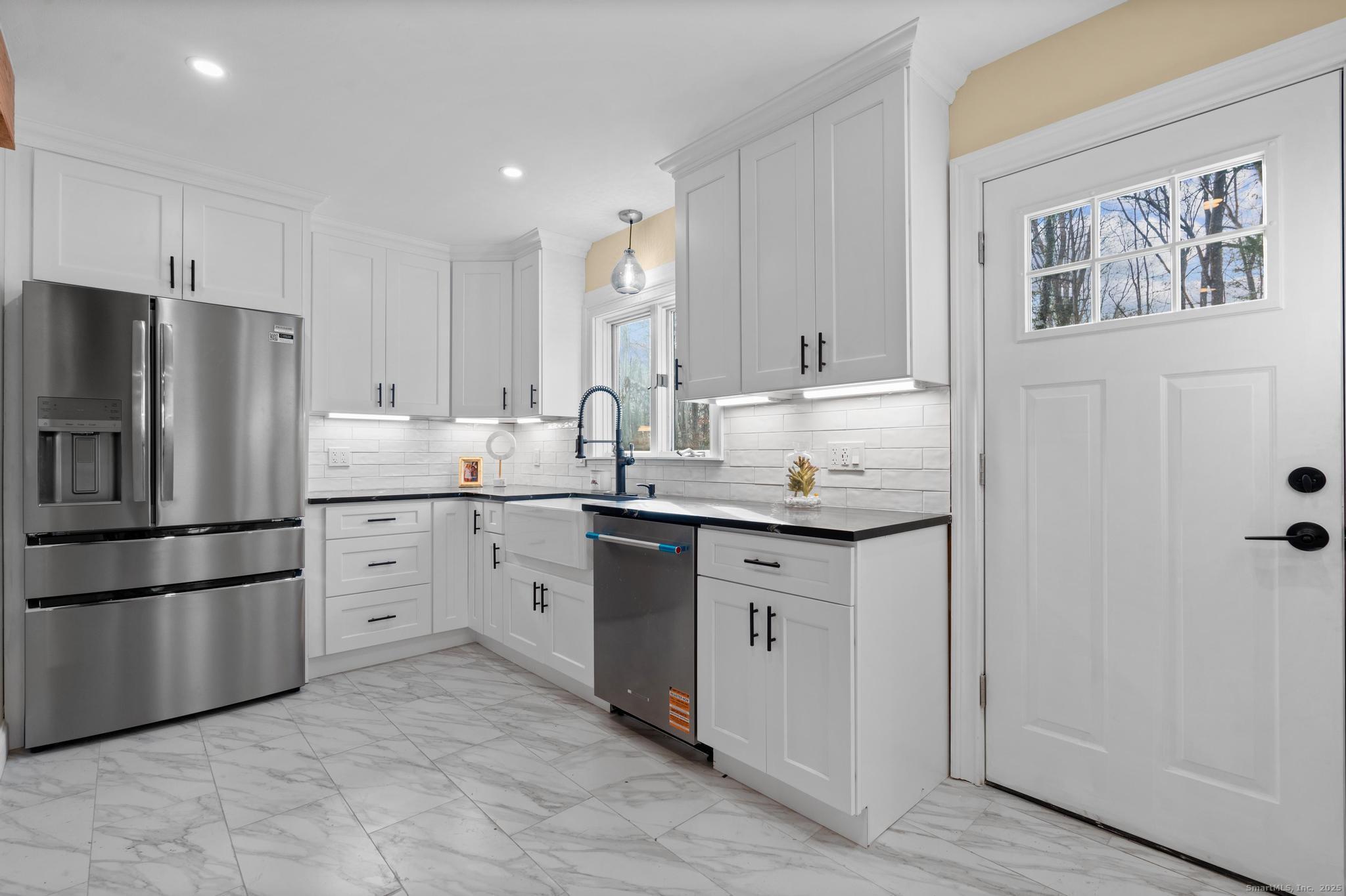 24 Evergreen Road North Branford, CT 06472 - Photo 10 of 31 a kitchen with appliances a sink and a refrigerator