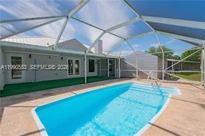 1063 Mayford Lake Road Moore Haven, FL 33471 - Photo 1 of 39 a view of swimming pool with an outdoor seating