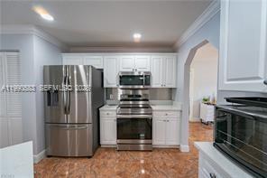 1063 Mayford Lake Road Moore Haven, FL 33471 - Photo 11 of 39 a kitchen with a stove sink and refrigerator