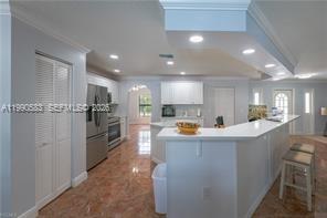 1063 Mayford Lake Road Moore Haven, FL 33471 - Photo 12 of 39 a view of kitchen with furniture and refrigerator
