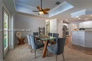 a spacious bedroom with a bed a dresser with the outer view