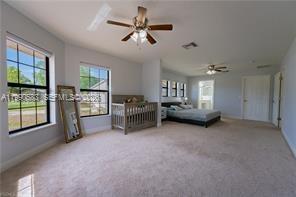 1063 Mayford Lake Road Moore Haven, FL 33471 - Photo 16 of 39 a living room with furniture and a ceiling fan