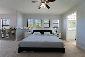 1063 Mayford Lake Road Moore Haven, FL 33471 - Photo 17 of 39 a bedroom with a bed and window