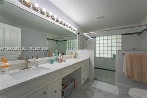 1063 Mayford Lake Road Moore Haven, FL 33471 - Photo 18 of 39 a bathroom with a sink double vanity and a mirror