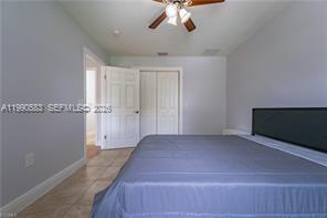1063 Mayford Lake Road Moore Haven, FL 33471 - Photo 21 of 39 wooden floor in an empty room with a window