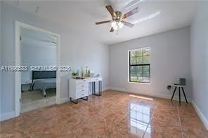 a bedroom that has a bed and chair