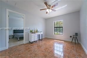 1063 Mayford Lake Road Moore Haven, FL 33471 - Photo 22 of 39 a living room with furniture and a window