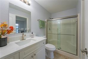 1063 Mayford Lake Road Moore Haven, FL 33471 - Photo 24 of 39 a bathroom with a sink toilet and shower
