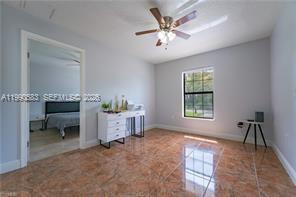 1063 Mayford Lake Road Moore Haven, FL 33471 - Photo 26 of 39 a living room with furniture and a chandelier