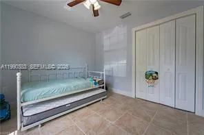 a view of swimming pool from a big yard