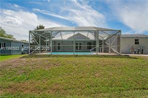 1063 Mayford Lake Road Moore Haven, FL 33471 - Photo 35 of 39 a view of a house with swimming pool