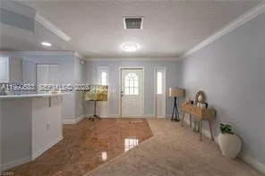 a open kitchen with kitchen island a sink table and chairs