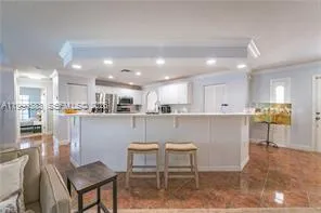 a kitchen with a stove sink and refrigerator