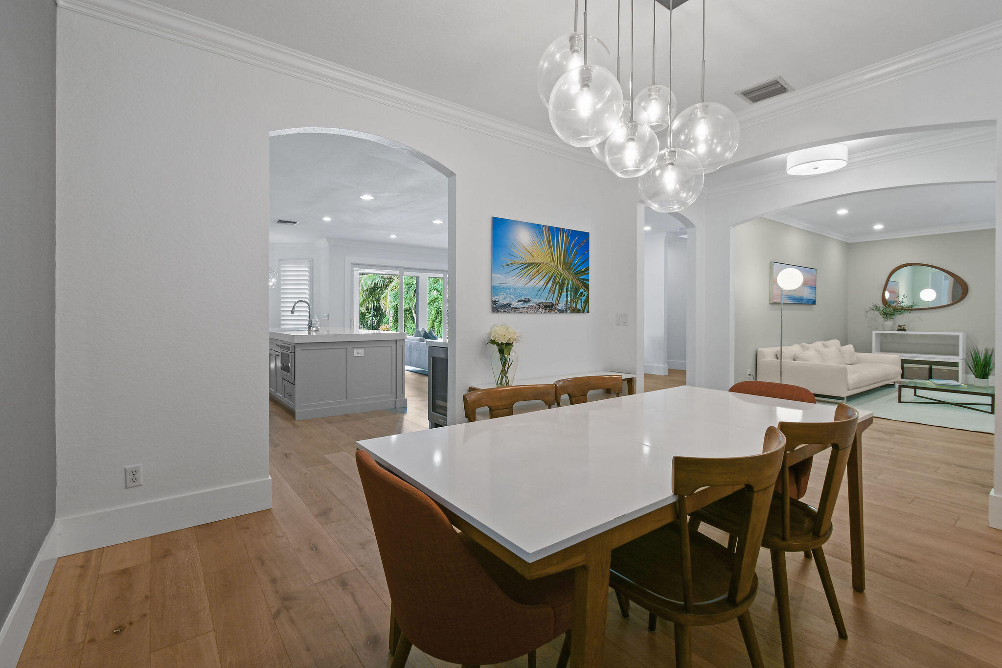 158 Ennis Lane Jupiter, FL 33458 - Photo 11 of 77 a view of a dining room with furniture and chandelier
