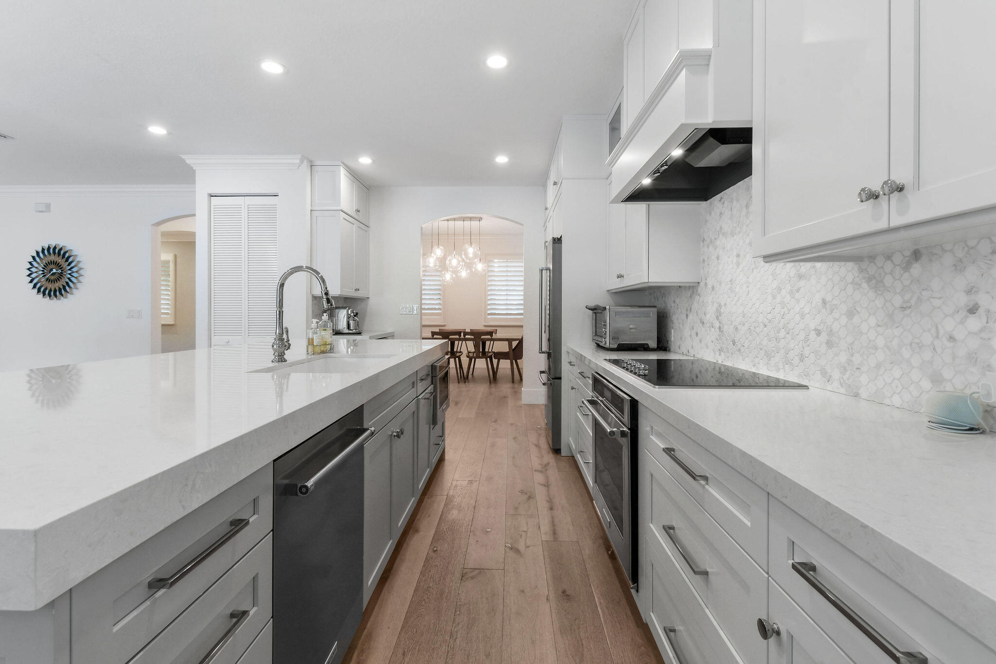 158 Ennis Lane Jupiter, FL 33458 - Photo 25 of 77 a large kitchen with stainless steel appliances lots of counter space sink and cabinets