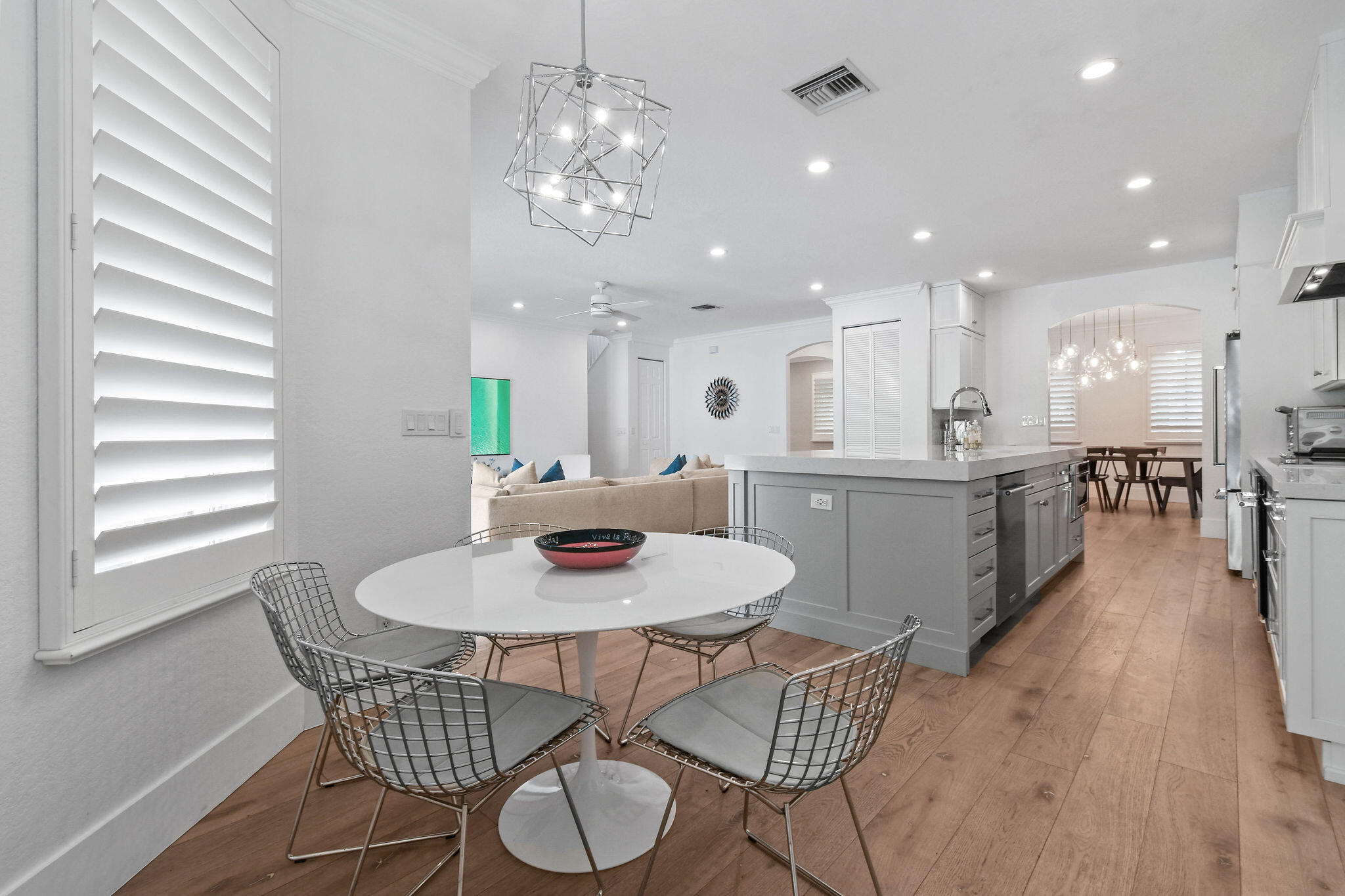 158 Ennis Lane Jupiter, FL 33458 - Photo 27 of 77 a view of a dining room with furniture and wooden floor