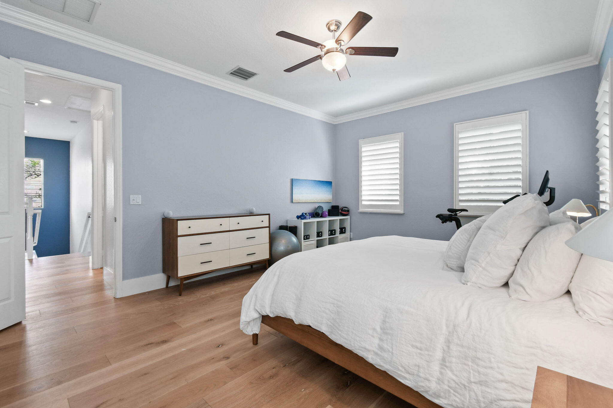 158 Ennis Lane Jupiter, FL 33458 - Photo 36 of 77 a bedroom with a bed and a chandelier