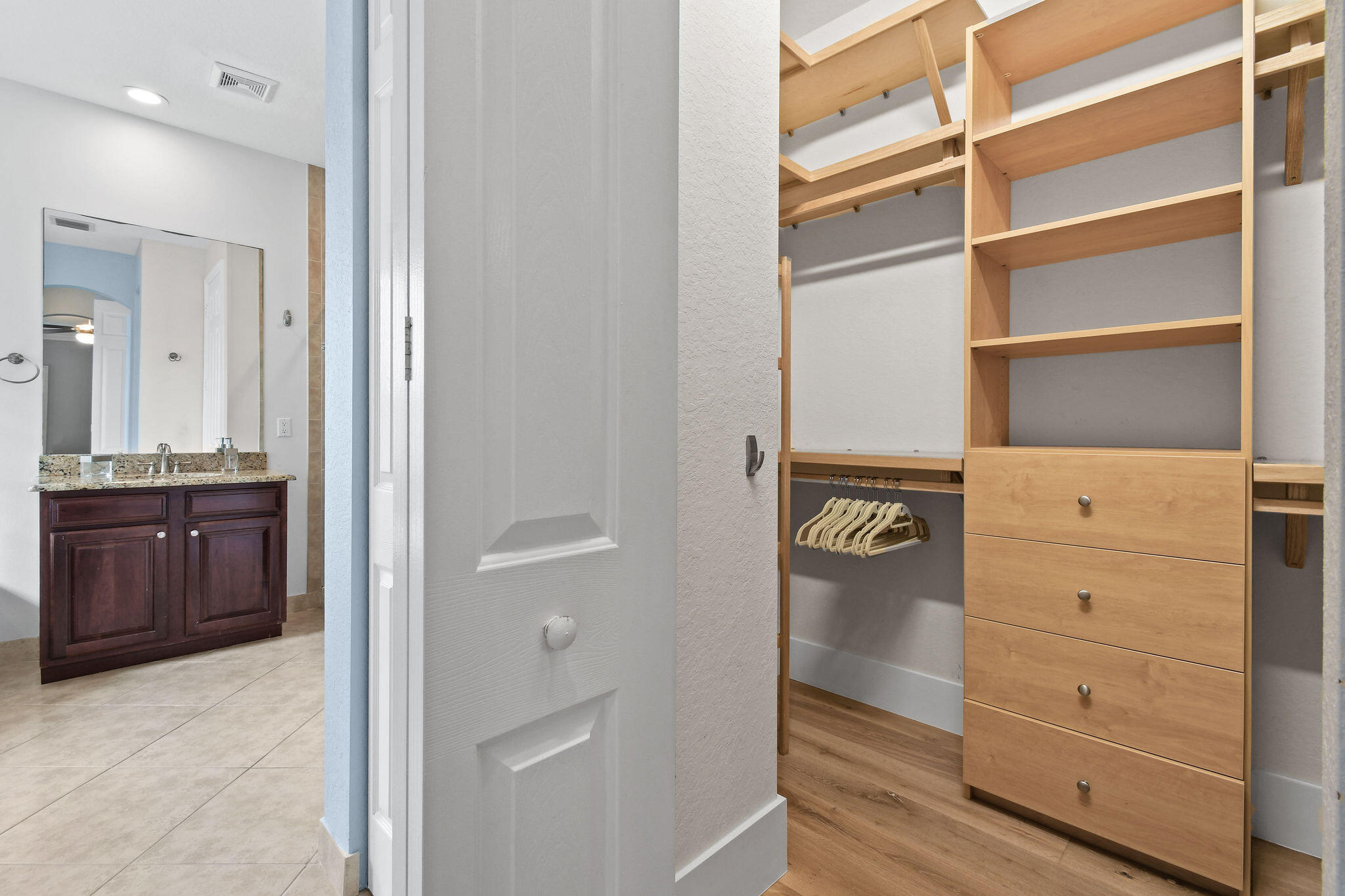 158 Ennis Lane Jupiter, FL 33458 - Photo 40 of 77 a view of walk in closet and bedroom