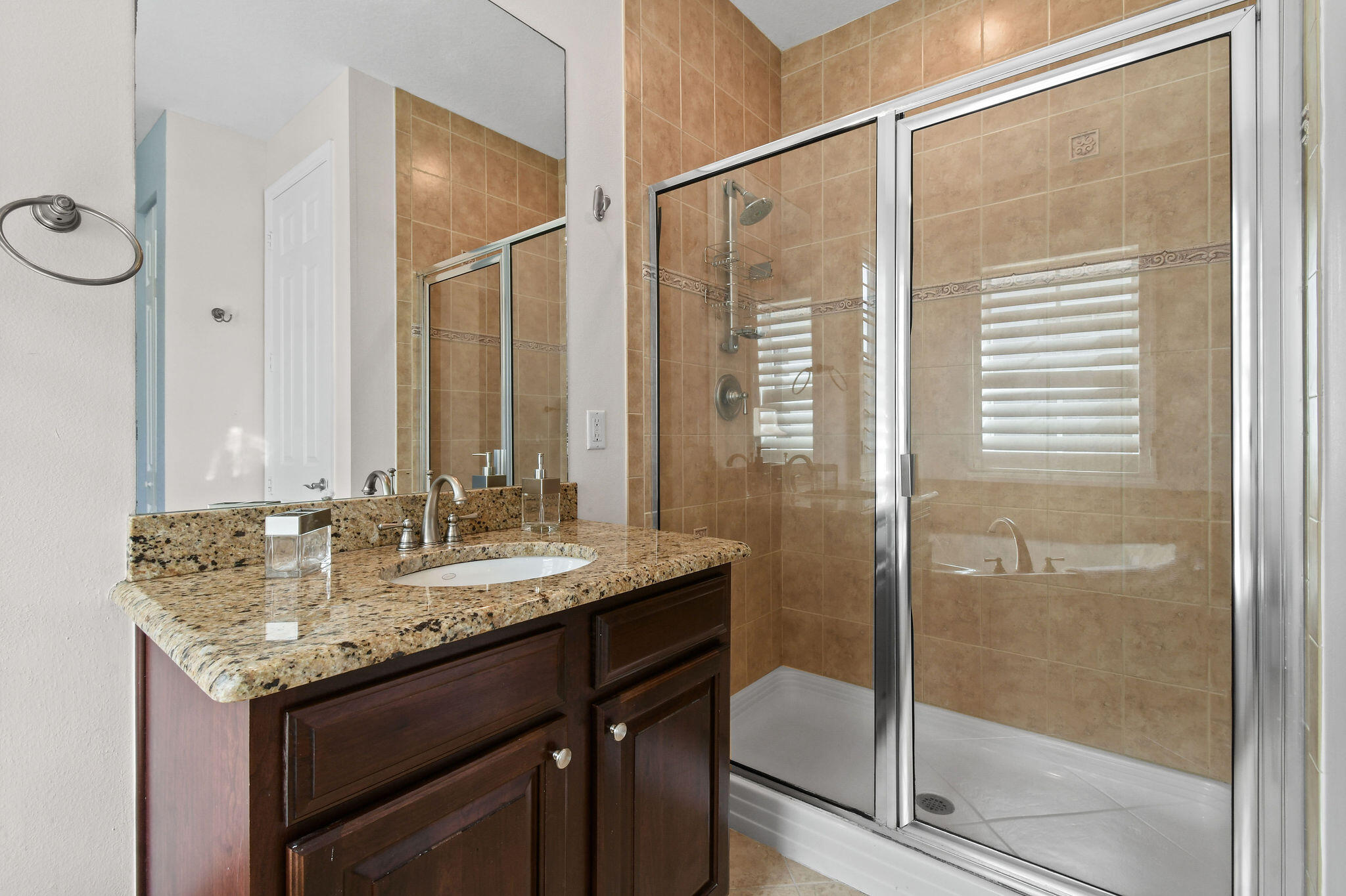 158 Ennis Lane Jupiter, FL 33458 - Photo 44 of 77 a bathroom with a granite countertop sink and a mirror