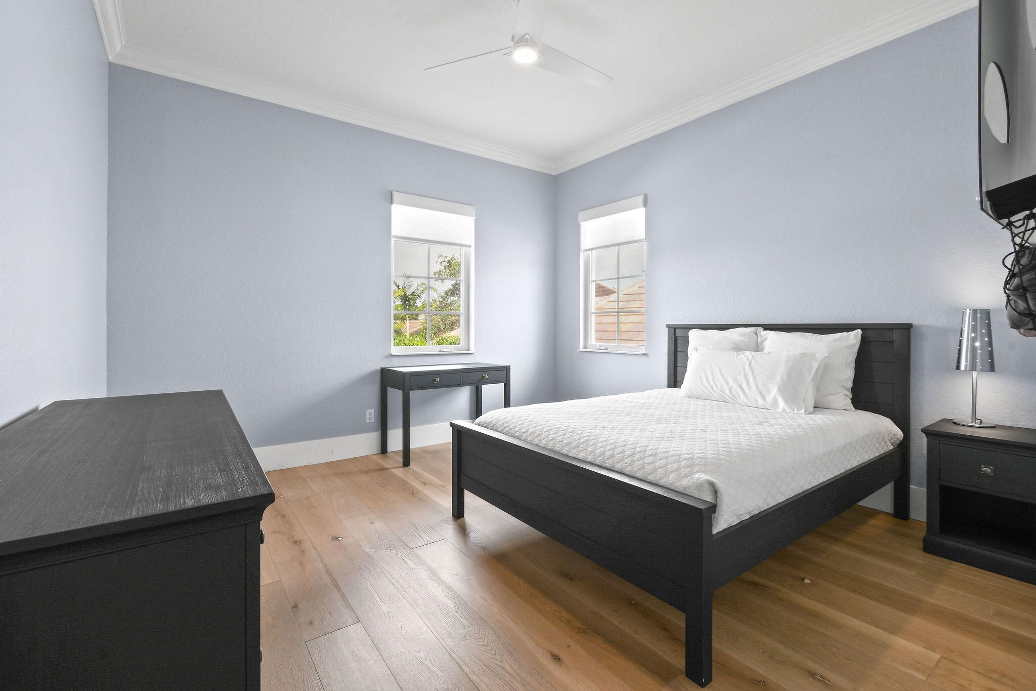 158 Ennis Lane Jupiter, FL 33458 - Photo 54 of 77 a bedroom with a bed and a desk in it