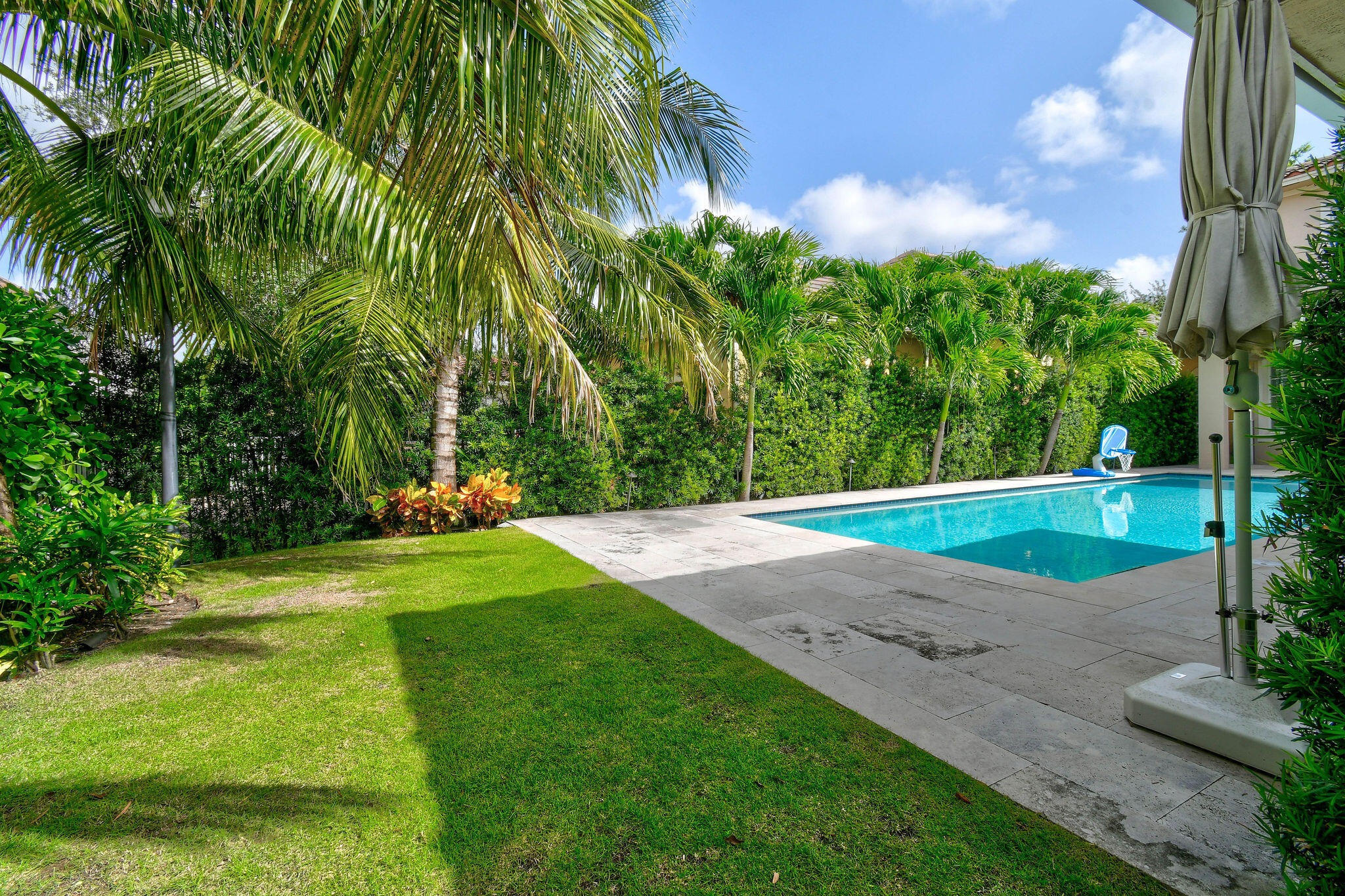 158 Ennis Lane Jupiter, FL 33458 - Photo 69 of 77 a view of a yard with palm trees