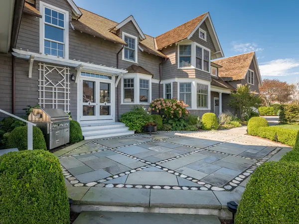 a front view of a house with garden