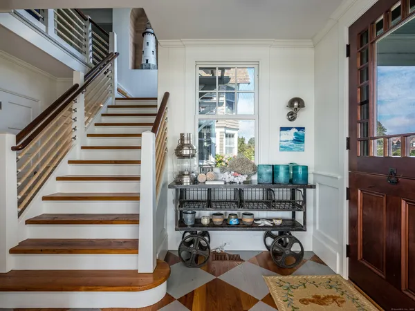 a room with lots of wooden furniture and a rug