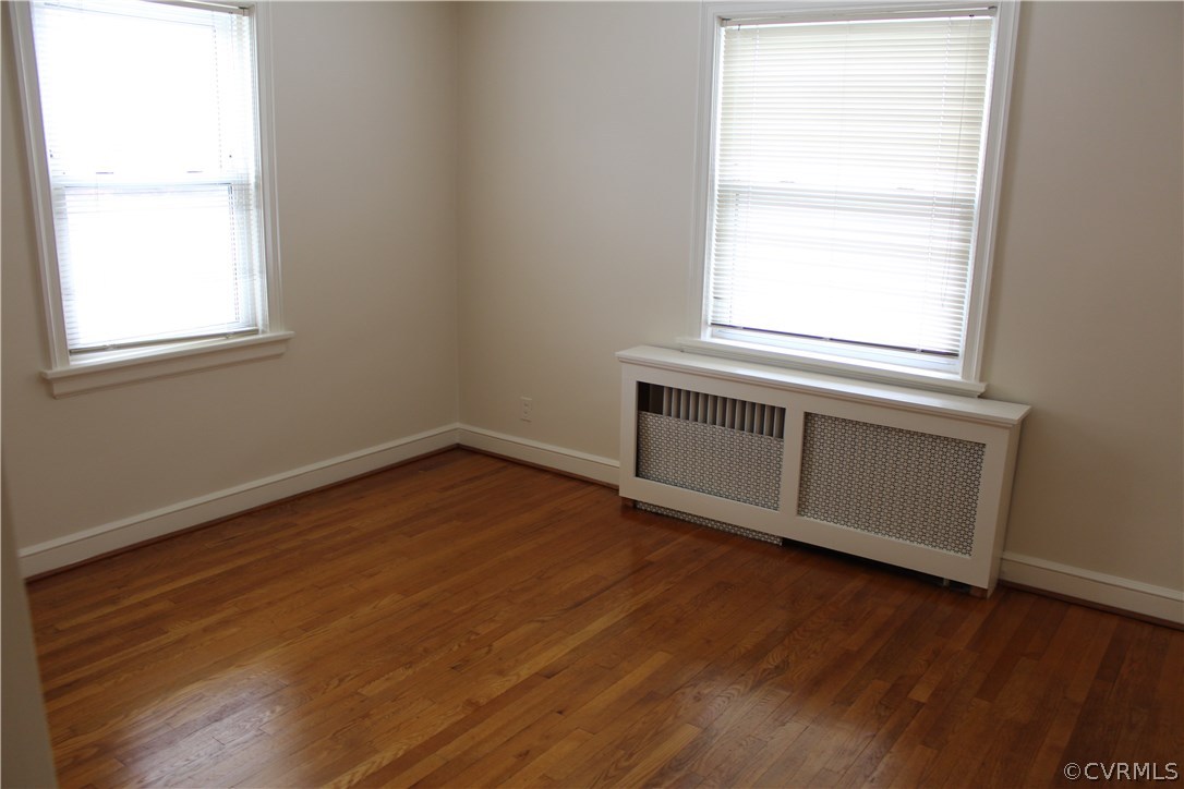 2426 Kenmore Road Henrico, VA 23228 - Photo 13 of 27 an empty room with wooden floor and windows