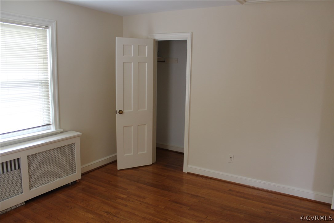 2426 Kenmore Road Henrico, VA 23228 - Photo 14 of 27 an empty room with wooden floor and window