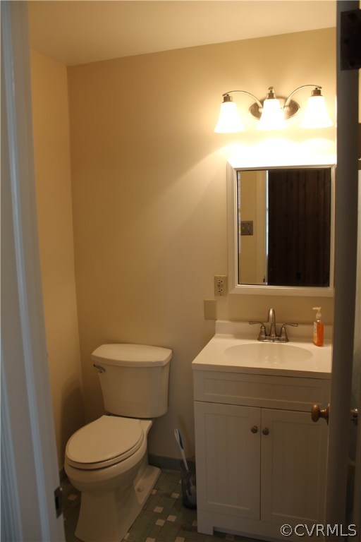 2426 Kenmore Road Henrico, VA 23228 - Photo 16 of 27 a bathroom with a toilet sink and mirror