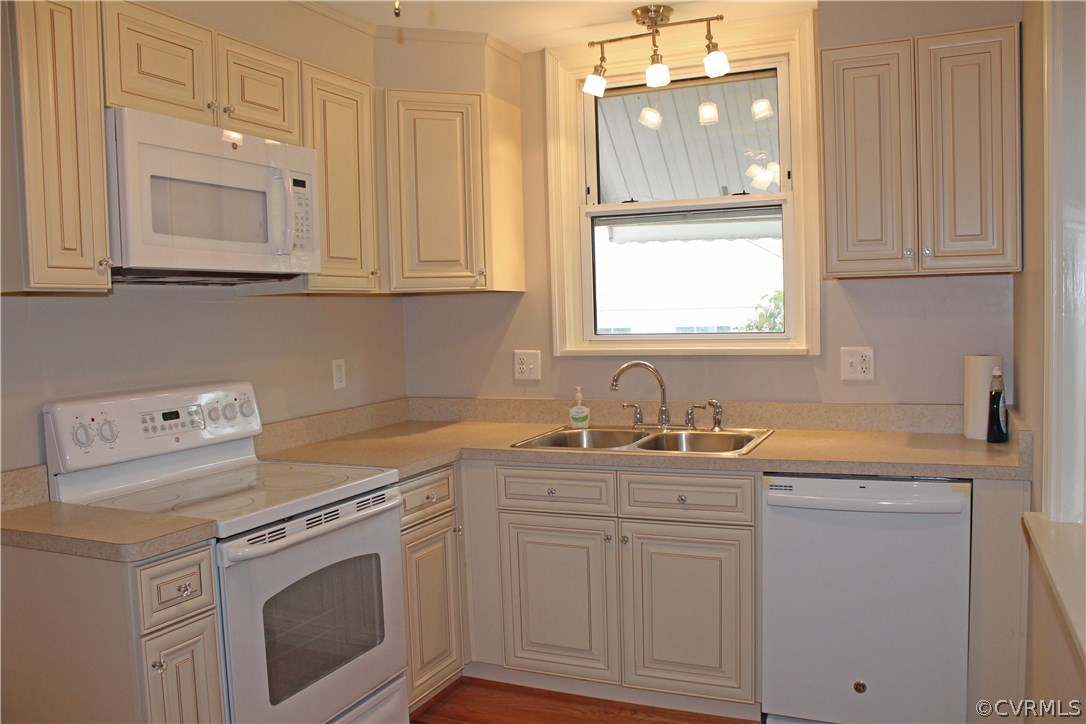 2426 Kenmore Road Henrico, VA 23228 - Photo 2 of 27 a kitchen with white cabinets and white appliances