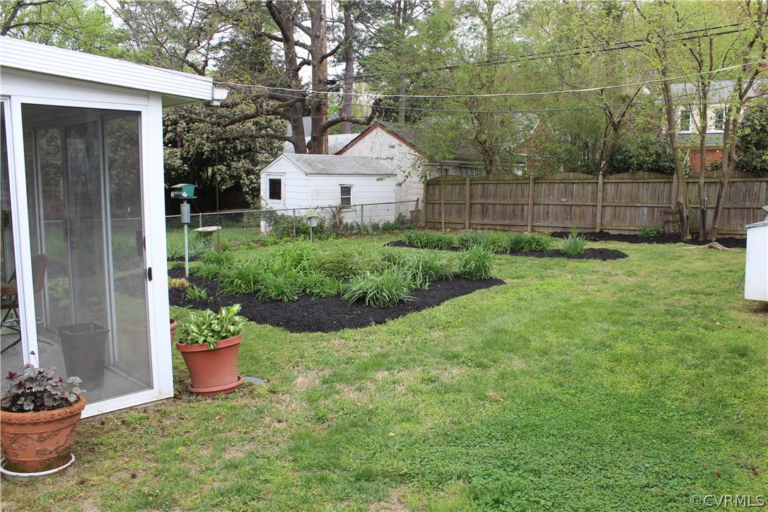 2426 Kenmore Road Henrico, VA 23228 - Photo 24 of 27 a front view of a house with a garden and plants