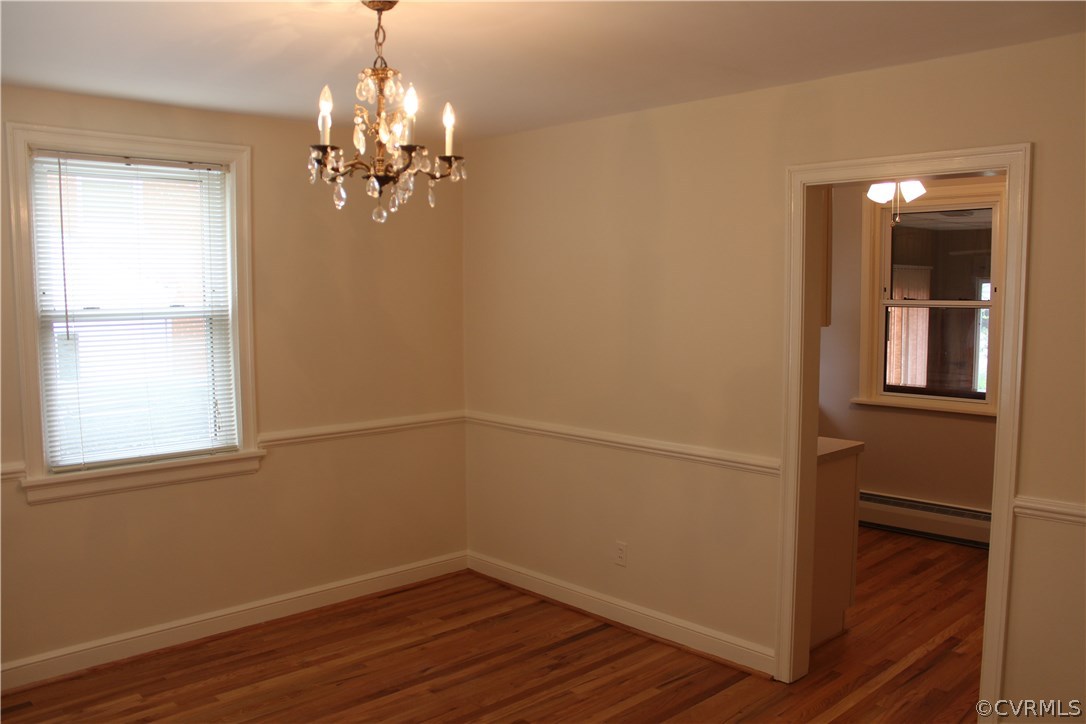 2426 Kenmore Road Henrico, VA 23228 - Photo 5 of 27 wooden floor in an empty room with a window