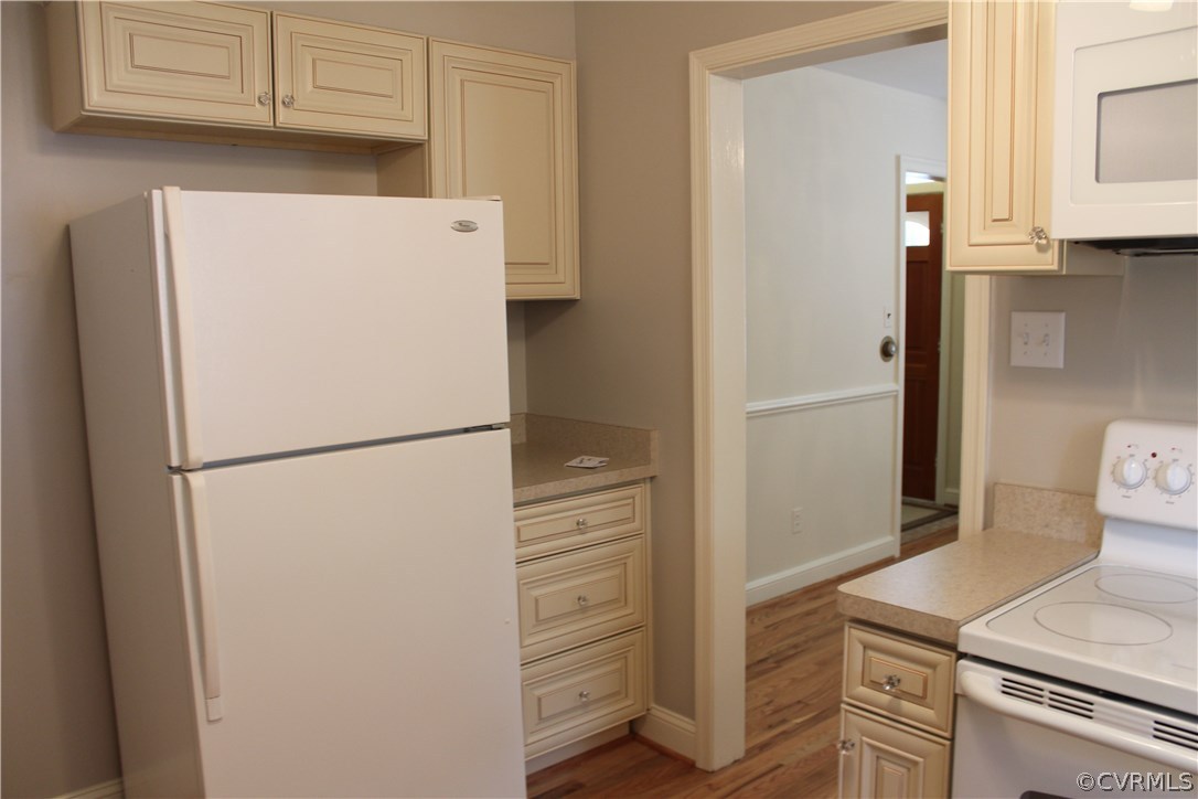 2426 Kenmore Road Henrico, VA 23228 - Photo 6 of 27 a white refrigerator freezer and a stove sitting inside of a kitchen