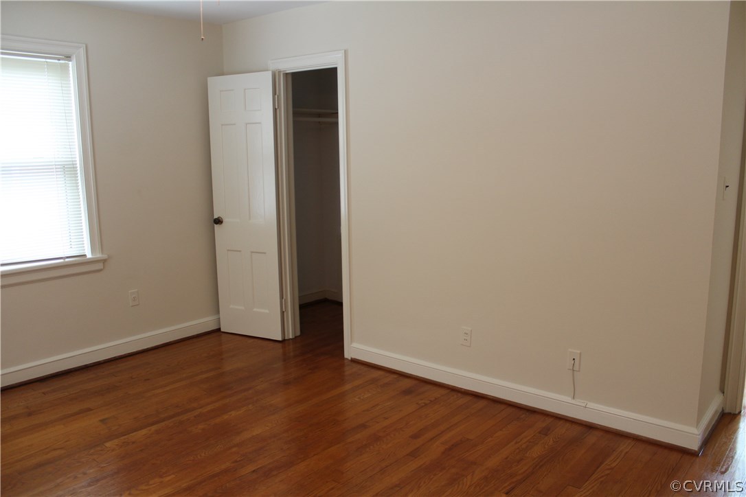 2426 Kenmore Road Henrico, VA 23228 - Photo 9 of 27 a view of an empty room with wooden floor and a window