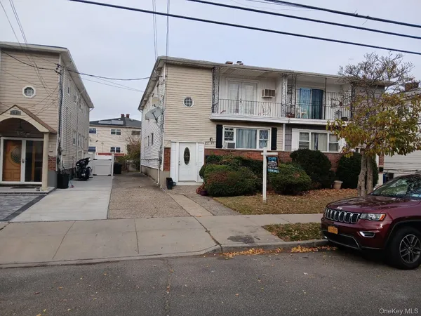 a view of a car park in front of house